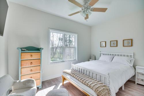 a bedroom with a bed and a ceiling fan at Bright and Elegant Home in High Point with Deck! in High Point