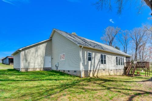 an old white church with a sign in the yard at Bright and Elegant Home in High Point with Deck! in High Point