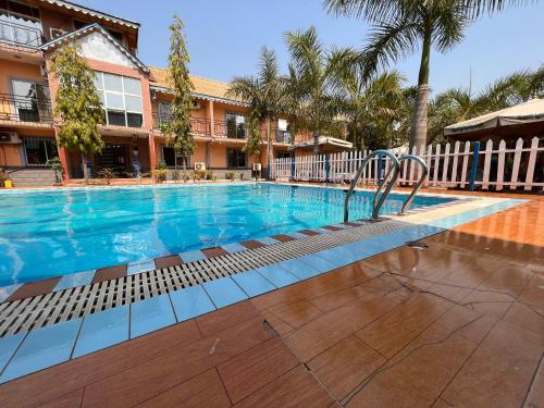 a swimming pool in front of a building at ROYAL HOTEL in Juba