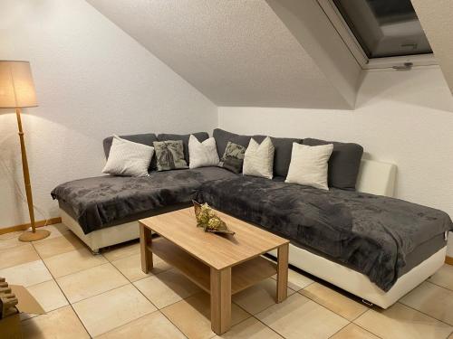 a living room with a couch and a table at Haus Stegmeir in Hohenweiler