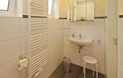 a white bathroom with a sink and a mirror at 2 Bedroom Stunning Apartment In Burg Stargard in Burg Stargard
