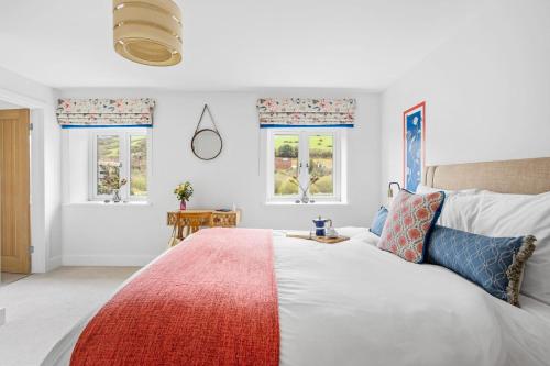 Postel nebo postele na pokoji v ubytování The Shippon, Dawlish