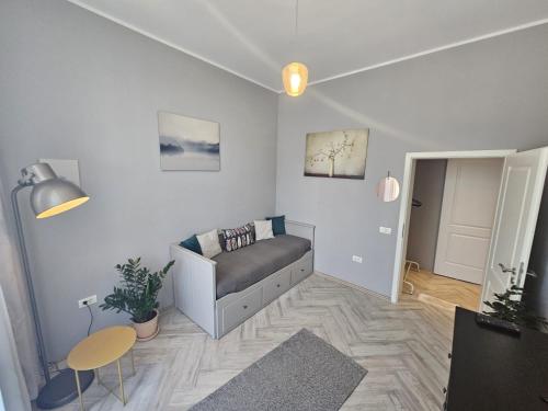 a living room with a couch and a table at ZIG ZAG apartment 4- Old Town in Constanţa
