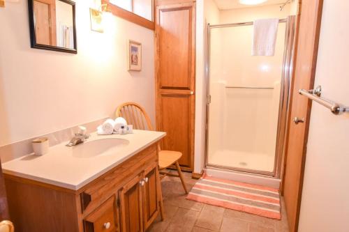 a bathroom with a sink and a shower at Steps to Nauset Beach Private Yard in Orleans