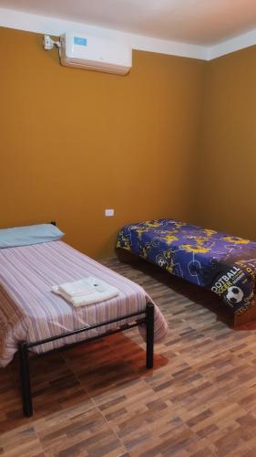 מיטה או מיטות בחדר ב-La Casa de Vinchina