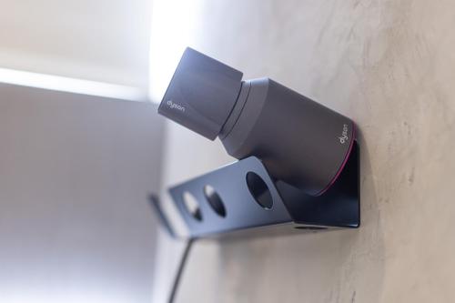 a flashlight hanging on a wall in a room at Green Hotel in Magong