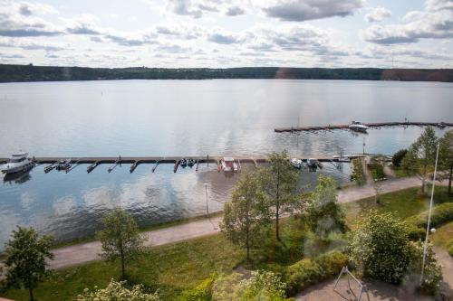 a view of a large lake with a dock at Deluxe Apartment with Lake View and Sauna, Lahti in Lahti