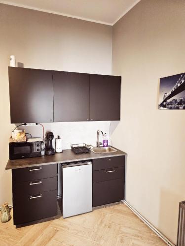 a kitchen with a sink and a counter top at ZIG ZAG apartment 6 - Old Town Constanta in Constanţa