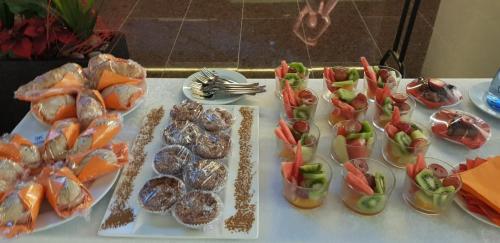 a table topped with plates of food and appetizers at Hotel 3K Europa in Lisbon