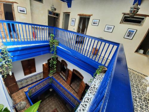 an overhead view of a building with blue stairs at Dar Halima in Essaouira
