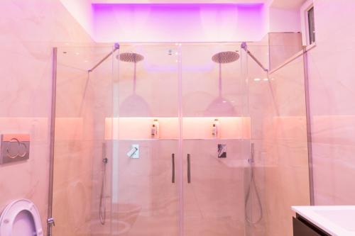 a shower with a glass door in a bathroom at Villa Venere - Amalfi Coast - Private Sea Access in Cetara