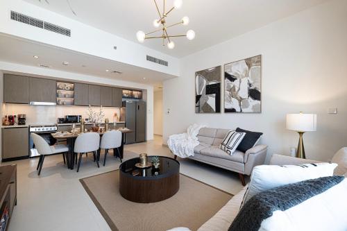 a living room with a couch and a table at Burj Crown - Spectacular Boulevard View, Opposite Dubai Mall in Dubai