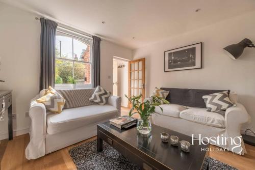 a living room with a couch and a coffee table at Stunning Character House In The Centre of Henley in Henley on Thames