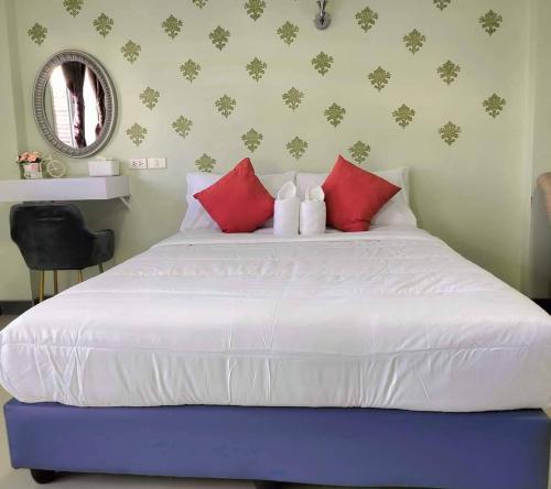 Postel nebo postele na pokoji v ubytování aSleep Hotel Sriracha แอสลีพ โฮเทล