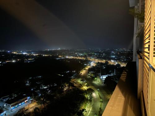 a view of a city lit up at night at Executive Condo unit @ the Palladium in Iloilo City