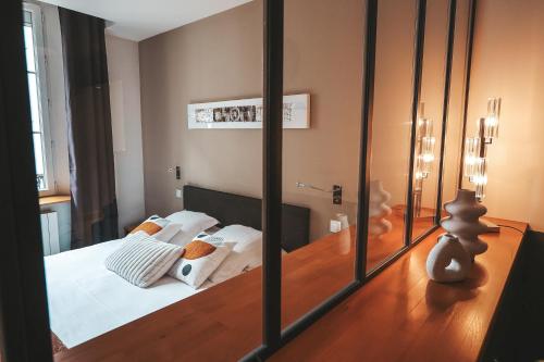 Postel nebo postele na pokoji v ubytování Suit'Home Commerce