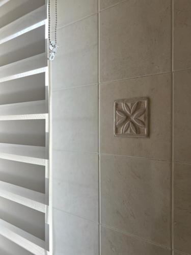 a shower with a glass door in a bathroom at TreMonti in Guardiagrele