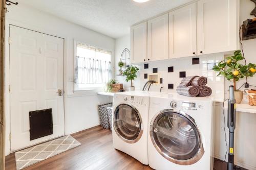 a laundry room with a washer and dryer at Walk to University Dtown Laramie Home! in Laramie