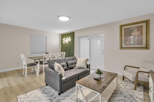 a living room with a couch and a table at Central Downtown Living in Buffalo