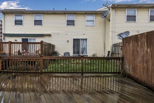 a wooden fence in front of a house at Central Downtown Living in Buffalo