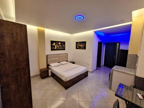 a bedroom with a bed and a blue light at Jasmine Resort & Aqua park in Sharm El Sheikh