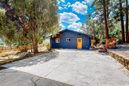 a blue shed with a driveway in front of it at Durango Tango in Durango