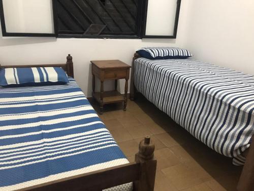 Łóżko lub łóżka w pokoju w obiekcie Alojamiento Munay con cochera para 2 vehiculos