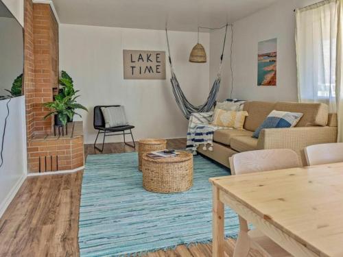 a living room with a couch and a table at Lake House Escape, Venture Base Unit 7 in Kanab