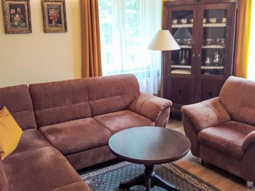 a living room with a couch and a table at Holiday Home Baracka by Interhome in Martinske Hole