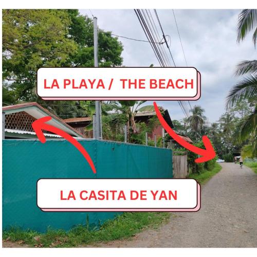 a sign that reads la playa the beach and la casita de yarm at La Casita de Yan in Puerto Viejo