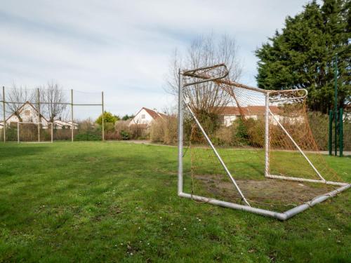 a soccer goal in the middle of a field at Holiday Home Zeewind 145 by Interhome in Bredene