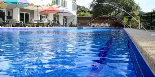 Bazén v ubytování Hotel Rega Suites Guayabitos - Family & Kitchen nebo v jeho okolí