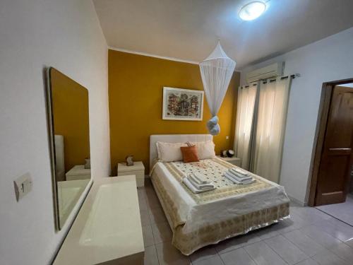 Кровать или кровати в номере Villa Ngorè Saly