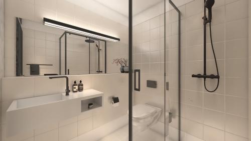 a white bathroom with a shower and a toilet at Boutiquehotel Drei Ringe in Schwörstadt