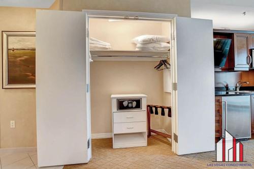 an open door to a kitchen with a refrigerator at MGM Signature-38-617 Top floor F1 View Balcony in Las Vegas