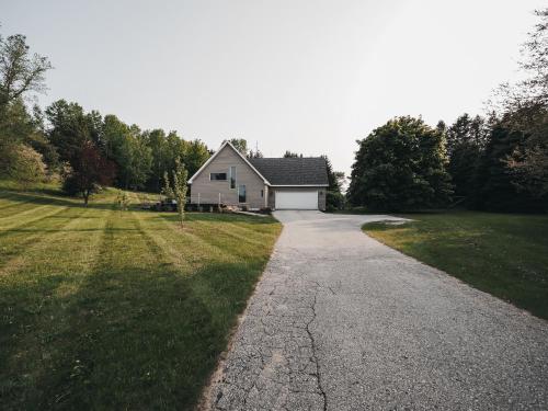 a driveway leading to a house at Modern Retreat near Traverse City in Cedar