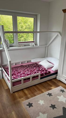 a bedroom with a bunk bed with stars on it at Familientraum in Großweitzschen