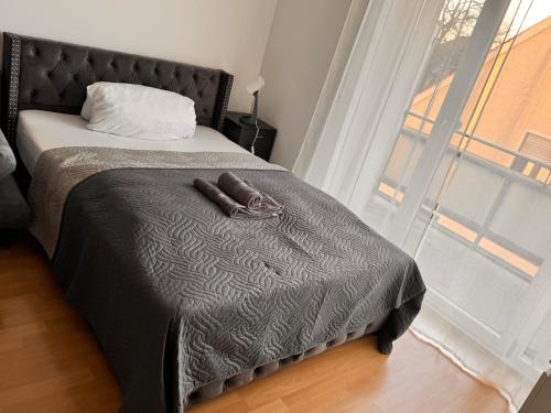 מיטה או מיטות בחדר ב-Gemütliches 1 Zimmer Apartment