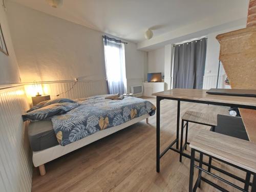 Letto o letti in una camera di Studio entier proche des commerces - 1 à 2 pers -