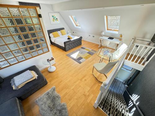 an overhead view of a living room with a couch at Luxury, private, secure self-contained Coach House, near Wythall and close to the NEC in Tanworth