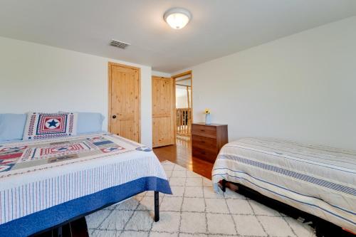 a bedroom with two beds and a dresser at Pet-Friendly Cabin on 3 Acres 7 Mi to Uvalde! in Uvalde