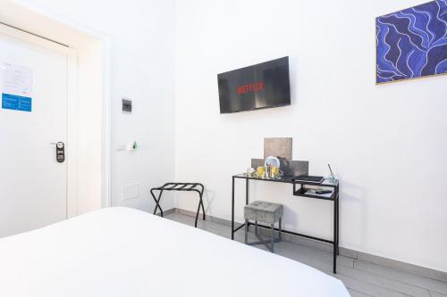 Μια τηλεόραση ή/και κέντρο ψυχαγωγίας στο Trastevere Suites - Top Collection