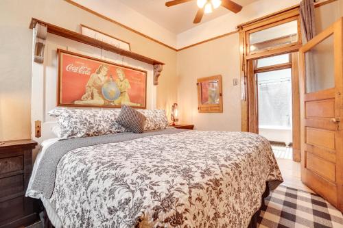 a bedroom with a large bed and a window at Vintage Downtown Laramie Apartment with Deck! in Laramie