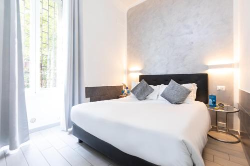 Ένα ή περισσότερα κρεβάτια σε δωμάτιο στο Trastevere Suites - Top Collection