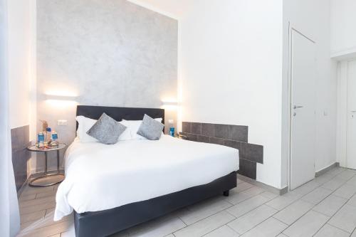Ένα ή περισσότερα κρεβάτια σε δωμάτιο στο Trastevere Suites - Top Collection
