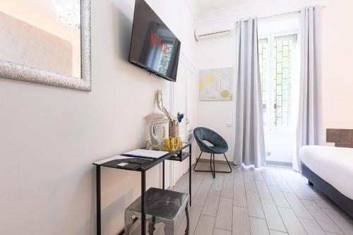 Μια τηλεόραση ή/και κέντρο ψυχαγωγίας στο Trastevere Suites - Top Collection
