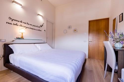 Cama o camas de una habitación en La Torre Rooms
