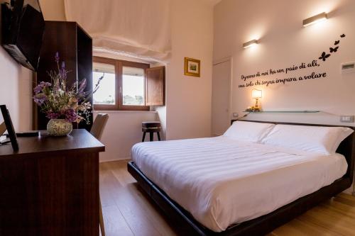 Cama o camas de una habitación en La Torre Rooms
