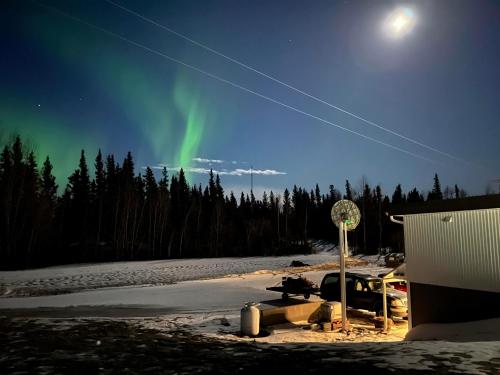 an image of the aurora dancing in the sky at Alaska Frontier Inn in Delta Junction