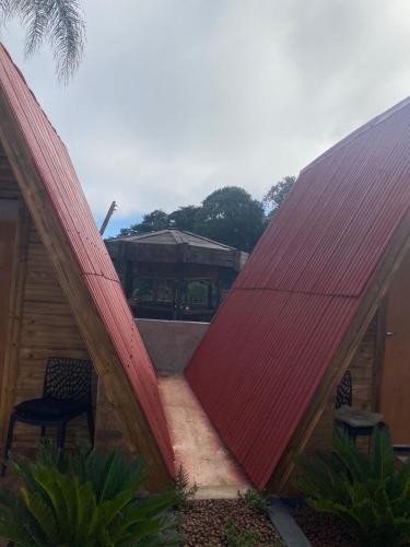a view of a house with a red roof at Chácara Recanto das Aves in Pilar do Sul